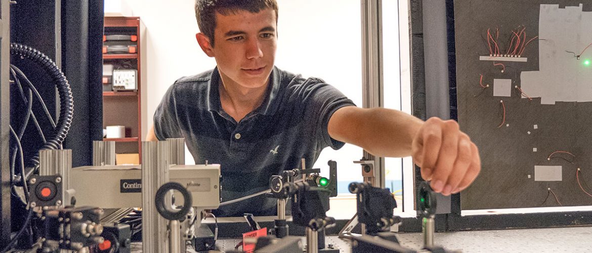 Student aligns piece of equipment before test